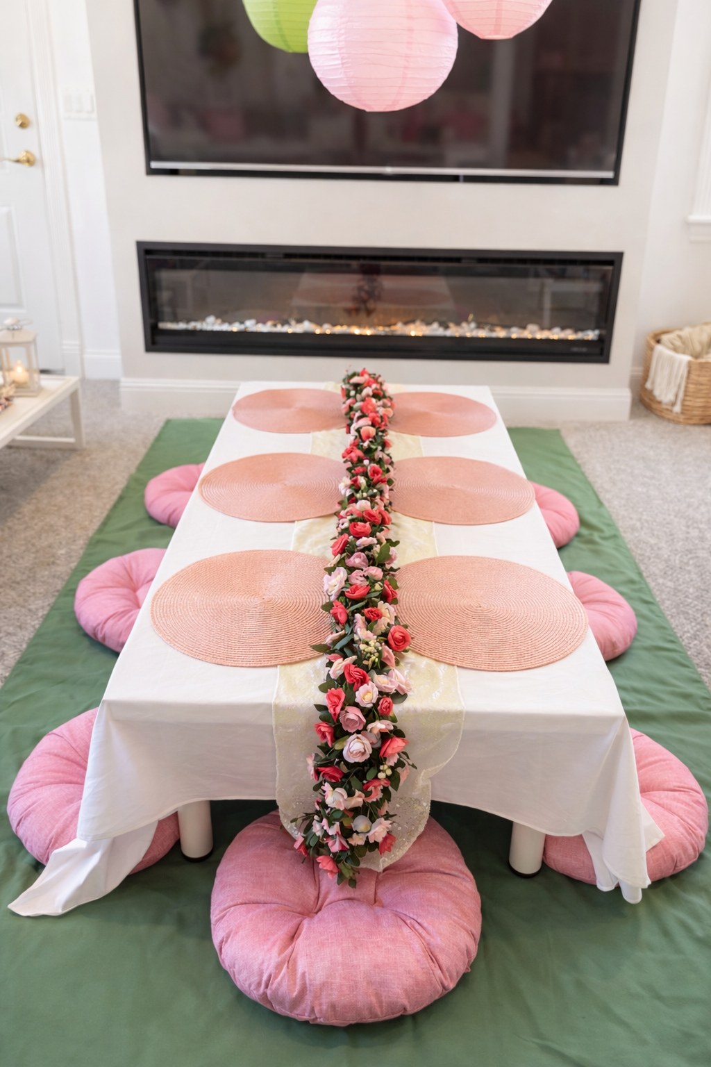 Sleepover party table with floral runner and round pink floor cushions — Sleepover Club Timonium MD