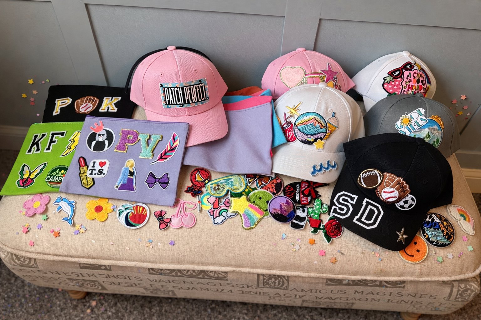 Full custom party box spread with hats, tote bags, and patches on a table — Sleepover Club Baltimore County MD