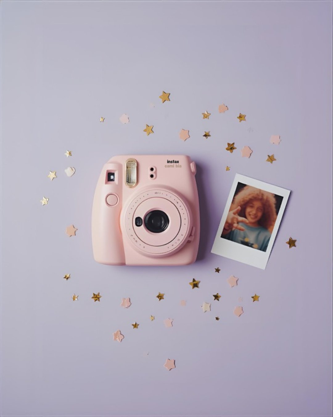 Instant camera with photos spread out
