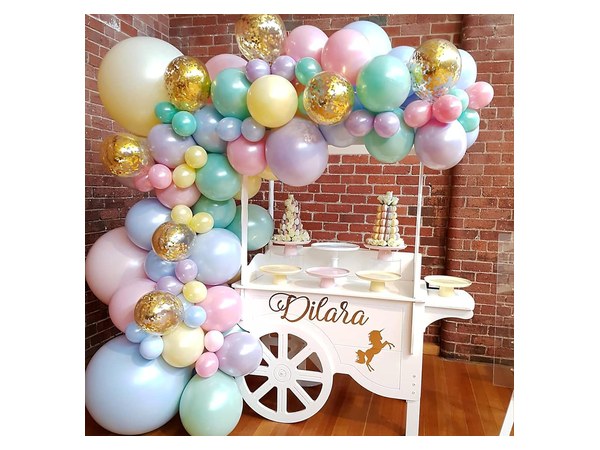 Pastel macaron balloon arch garland kit laid out in soft colors